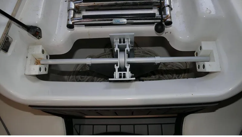 Slide: The Image of 2015 Yamaha AR240 boat interior with storage compartment and metal fittings. - 15