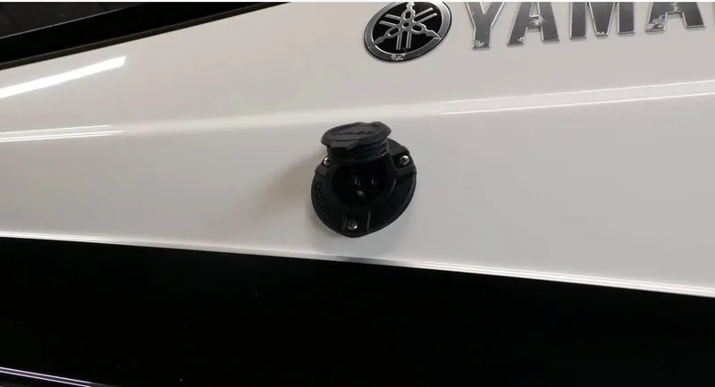 Slide: The Image of 2015 Yamaha AR240 boat exterior with fuel cap and logo detail. - 16