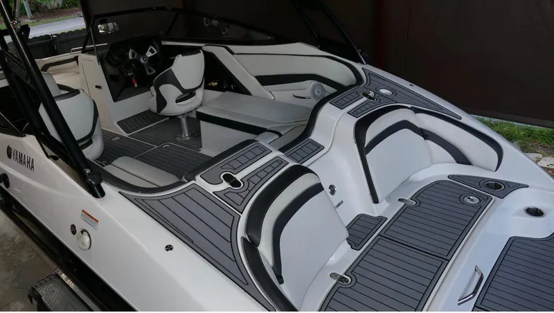 Slide: The Image of 2015 Yamaha AR240 boat interior with sleek seating and modern design. - 7