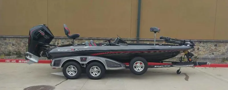 Slide: The Image of 2024 Ranger Z519 Ranger Cup Equipped boat on trailer, side view. - 1
