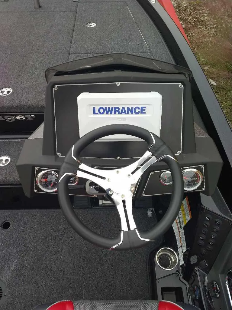 Slide: The Image of 2024 Ranger Z519 boat dashboard with Lowrance display and steering wheel. - 3