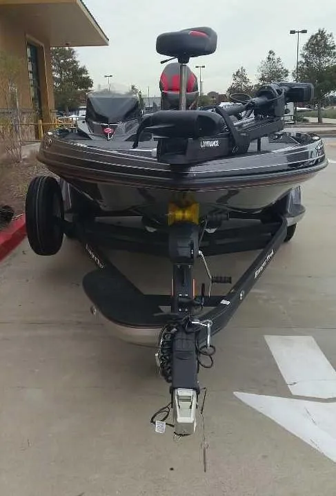 Slide: The Image of 2024 Ranger Z519 Ranger Cup Equipped boat on trailer, parked outdoors. - 5