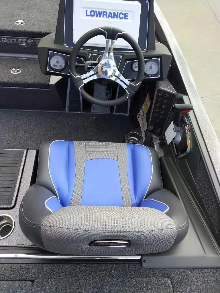 Slide: The Image of 2024 Ranger Z518 Ranger Cup boat cockpit with Lowrance electronics and blue seat. - 8