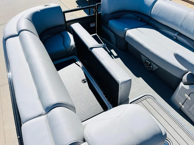 Slide: The Image of 2024 Regency 230 DL3 pontoon boat with spacious seating and storage compartments. - 17