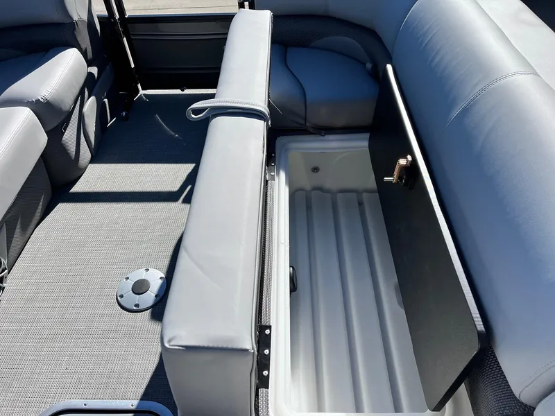 Slide: The Image of 2024 Regency 230 DL3 boat interior with open storage compartment. - 23