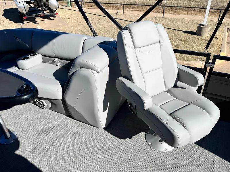 Slide: The Image of 2024 Regency 230 DL3 boat interior with luxurious gray seating. - 30