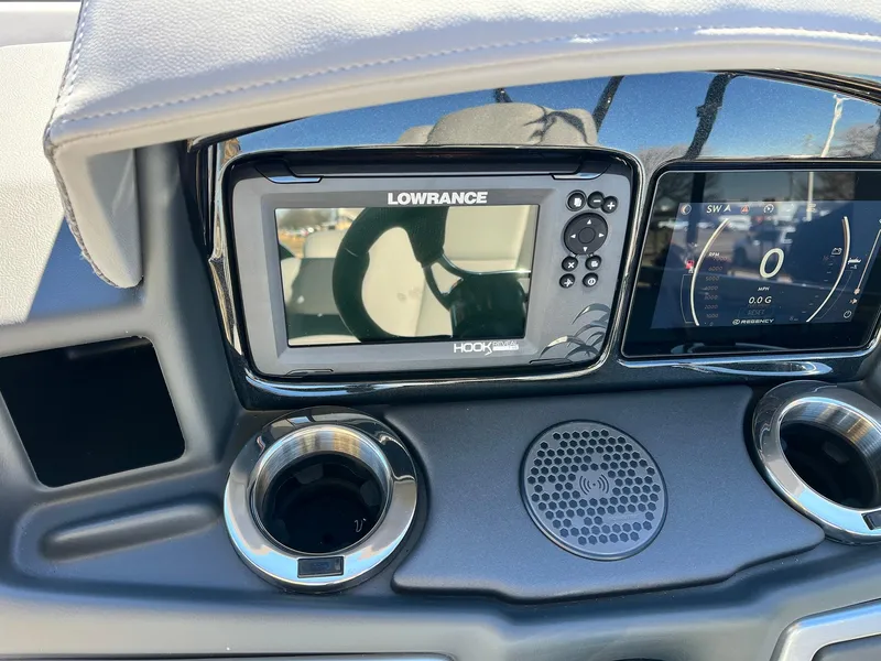 Slide: The Image of Dashboard of 2024 Regency 230 DL3 with Lowrance Hook Reveal fish finder. - 33