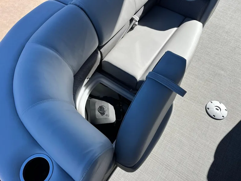 Slide: The Image of 2024 Regency 230 DL3 boat interior seating with storage compartment. - 43