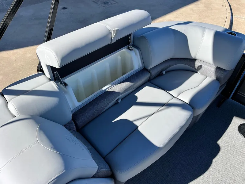 Slide: The Image of 2024 Regency 230 DL3 boat with spacious seating and storage compartment. - 46