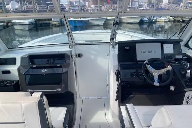 Slide: The Image of 2021 Blackfin 272DC boat cockpit with Garmin navigation system. - 6