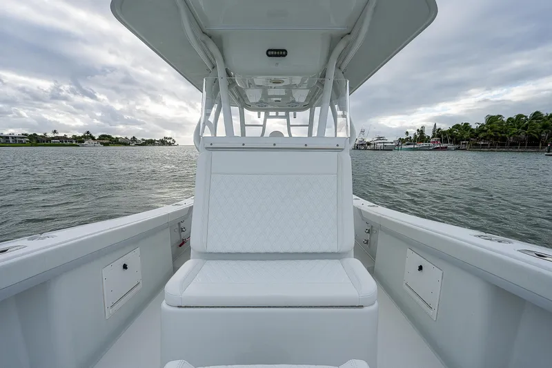 Slide: The Image of 2009 Yellowfin 36 boat with white seating on calm waters. - 13