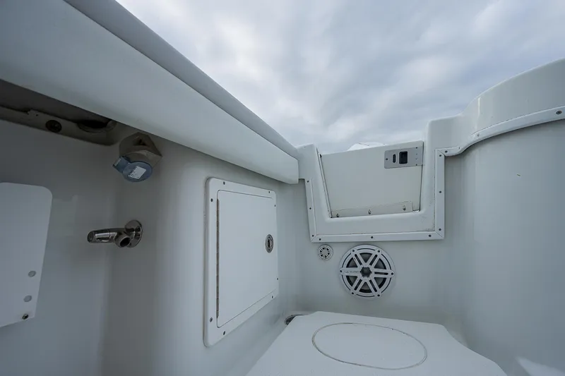 Slide: The Image of 2009 Yellowfin 36 boat interior with storage compartments and speaker. - 19