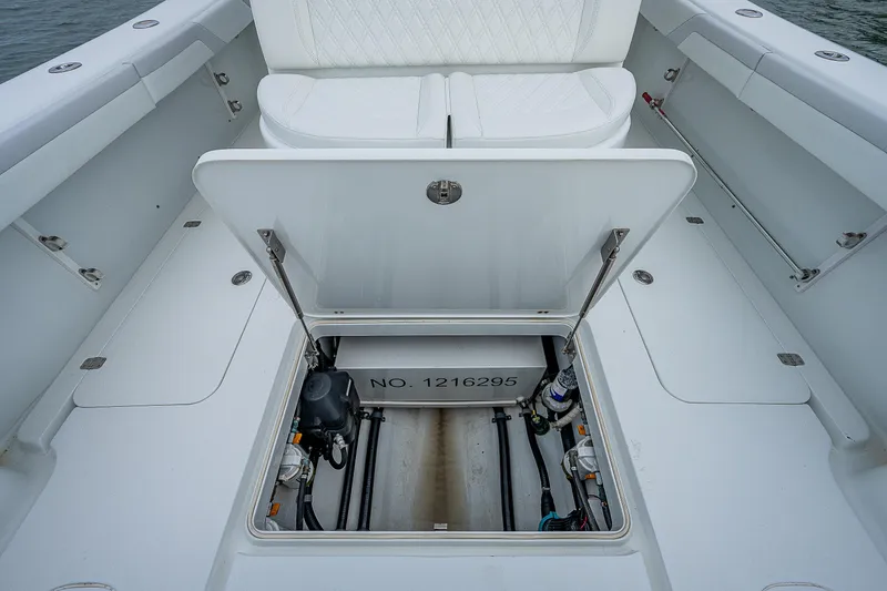 Slide: The Image of 2009 Yellowfin 36 boat with open hatch revealing storage compartment. - 24