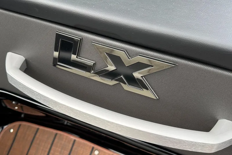 Slide: The Image of 2024 Manitou 25LX SRW logo on interior panel. - 4