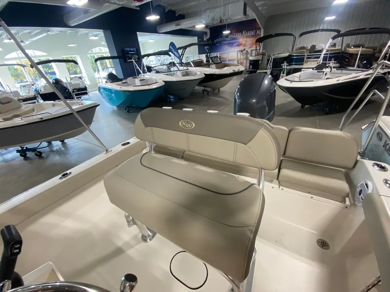 Slide: The Image of 2024 Key West 189 FS boat interior at a showroom with other boats. - 10