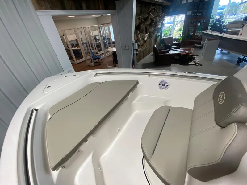 Slide: The Image of 2024 Key West 189 FS boat interior with seating and storage compartments. - 14
