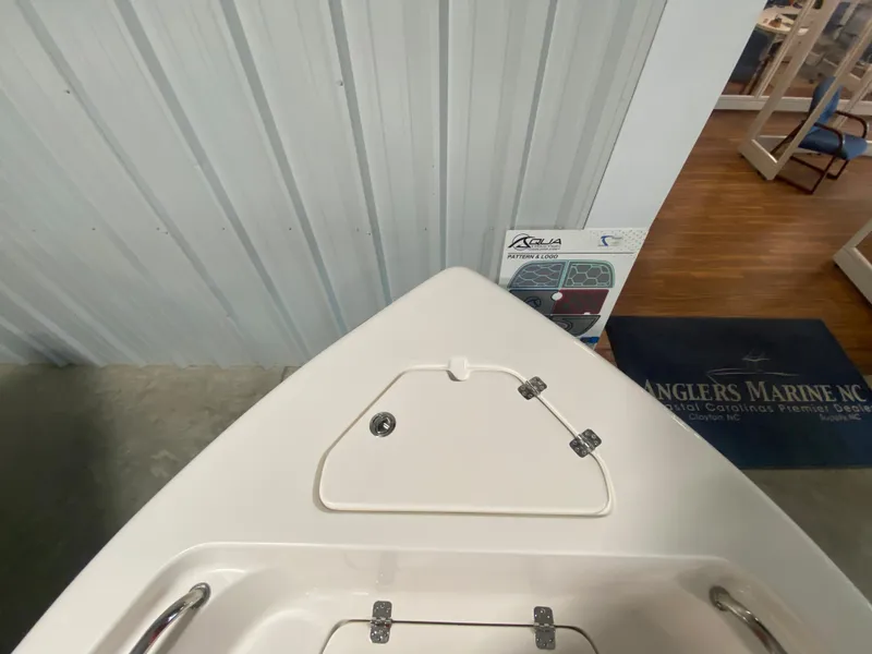 Slide: The Image of 2024 Key West 189 FS boat bow storage compartment in showroom. - 19