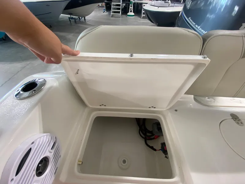 Slide: The Image of 2024 Key West 189 FS boat storage compartment with open lid. - 8