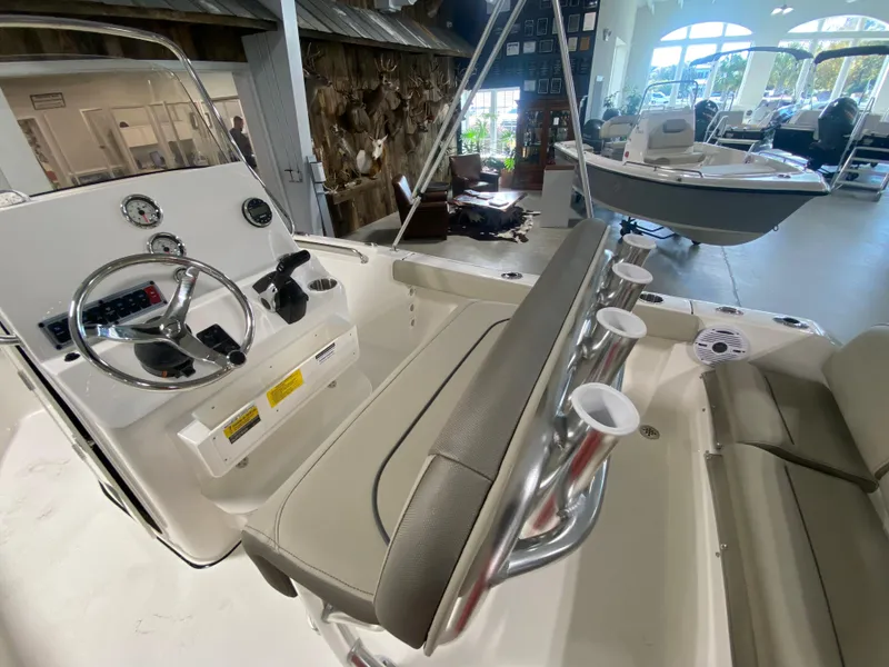Slide: The Image of 2024 Key West 189 FS boat interior with steering console and seating. - 9