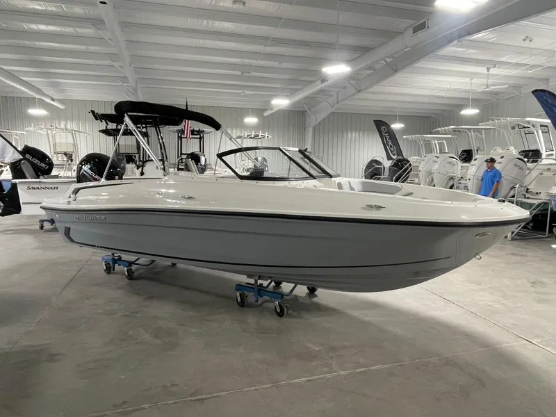Slide: The Image of 2024 Bayliner VR4 boat displayed in a showroom. - 3