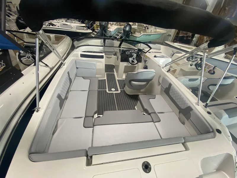 Slide: The Image of 2024 Bayliner VR4 boat interior with spacious seating and modern design. - 4
