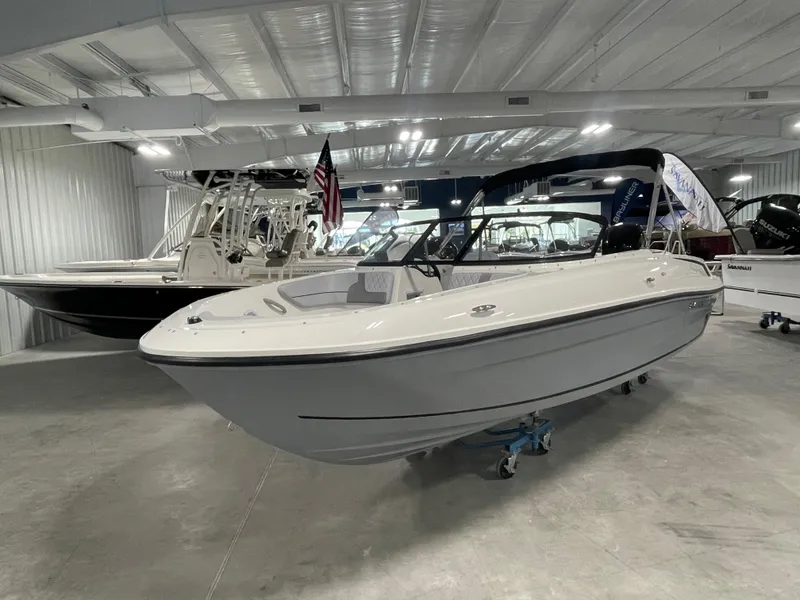 Slide: The Image of 2024 Bayliner VR4 boat displayed in a showroom. - 2