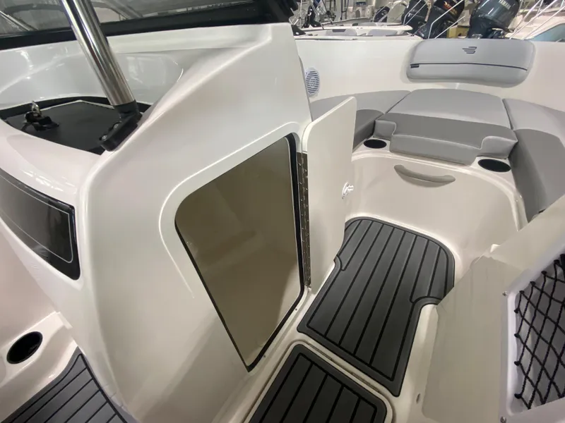 Slide: The Image of 2024 Bayliner VR4 boat interior with seating and storage compartments. - 20