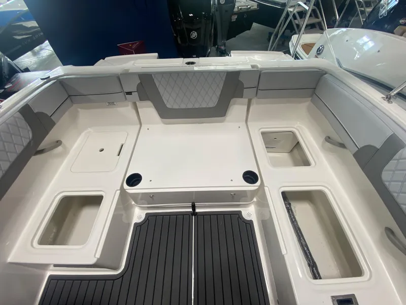 Slide: The Image of 2024 Bayliner VR4 boat interior with seating and storage compartments. - 6