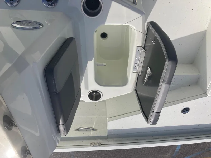 Slide: The Image of 2023 Lowe BAY 20 boat interior with open storage compartment and seating. - 7