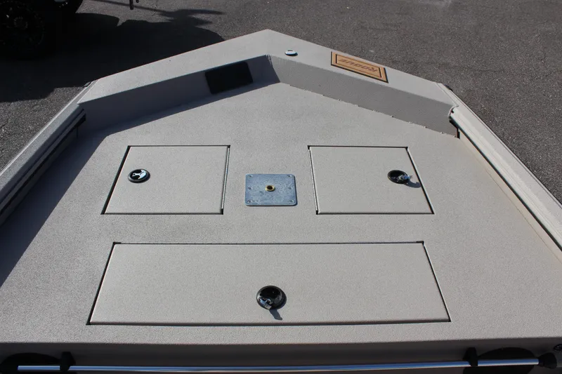 Slide: The Image of 2024 Avid 18 Rogue boat deck with storage compartments and mounting plate. - 12