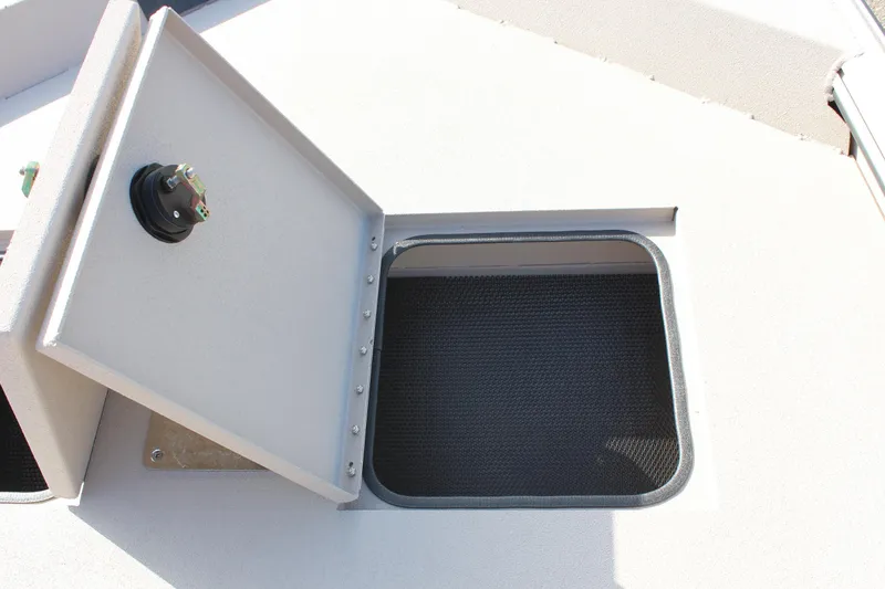 Slide: The Image of Open storage compartment on the 2024 Avid 18 Rogue boat. - 14