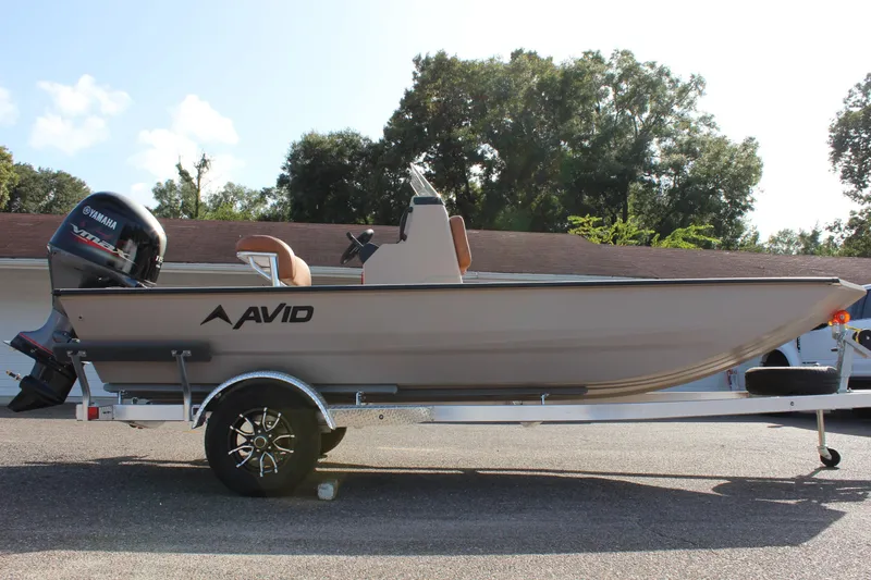 Slide: The Image of 2024 Avid 18 Rogue boat on trailer with Yamaha outboard motor. - 6