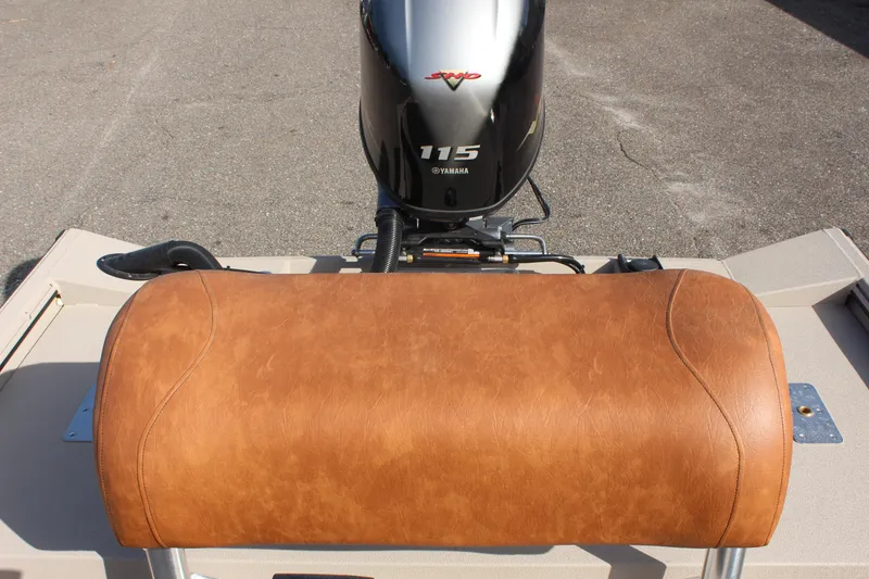 Slide: The Image of 2024 Avid 18 Rogue boat with Yamaha 115 engine and tan leather seat. - 8