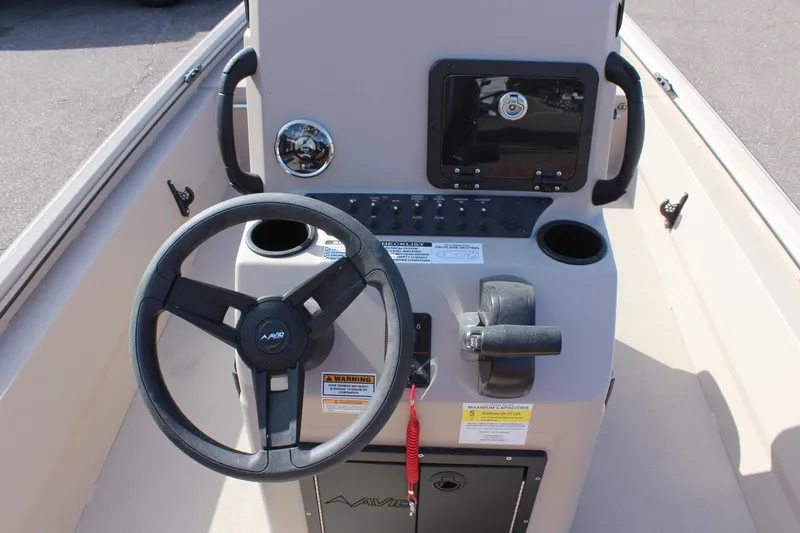 Slide: The Image of 2024 Avid 18 Rogue boat console with steering wheel and controls. - 9