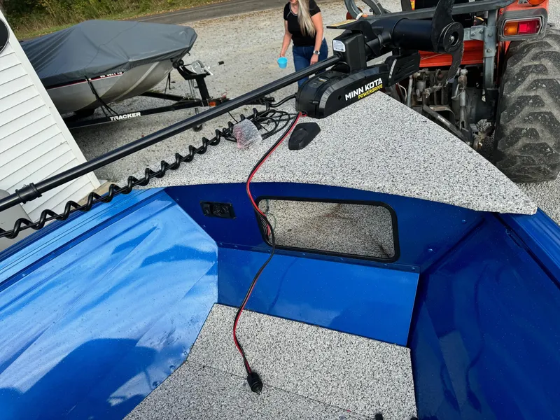 Slide: The Image of 2024 Polar Kraft Outlander 165 boat with Minn Kota trolling motor. - 6