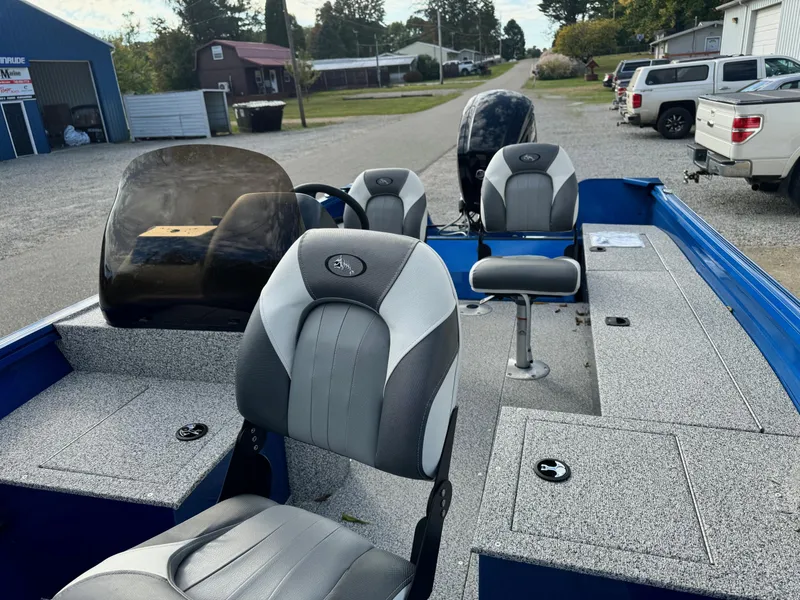 Slide: The Image of 2024 Polar Kraft Outlander 165 boat interior with seating and steering console. - 8