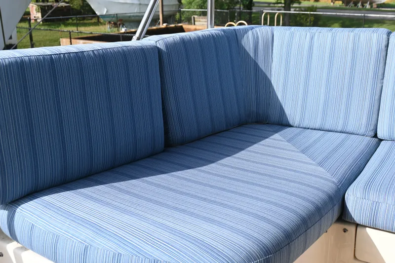 Slide: The Image of Blue cushioned seating on 2012 Sabre 48 Salon Express yacht. - 15