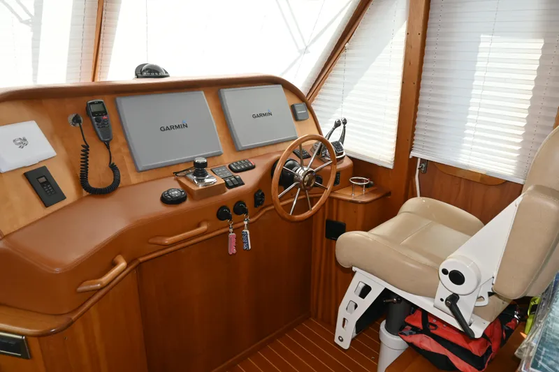 Slide: The Image of Interior helm of 2012 Sabre 48 Salon Express with Garmin navigation systems. - 16