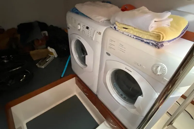 Slide: The Image of Laundry area with washer and dryer on 2012 Sabre 48 Salon Express yacht. - 23