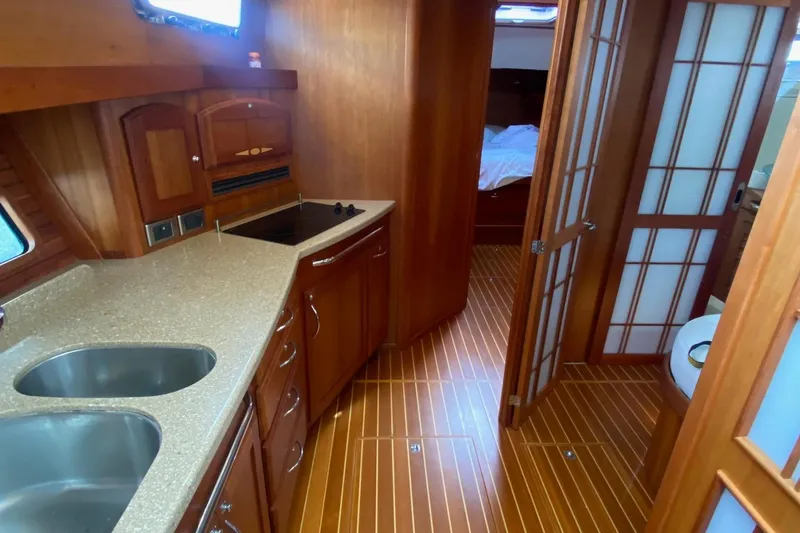 Slide: The Image of Interior of 2012 Sabre 48 Salon Express yacht with wood finish and modern kitchen. - 28
