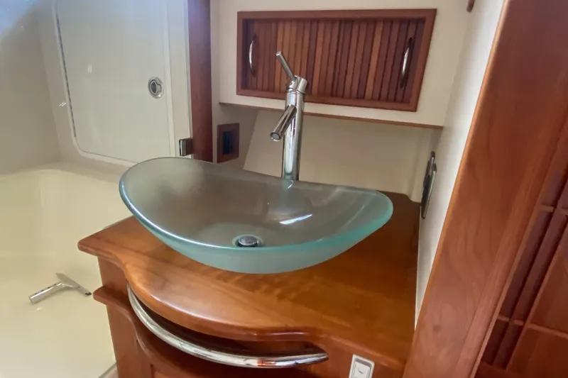 Slide: The Image of Glass sink in 2012 Sabre 48 Salon Express yacht bathroom. - 31