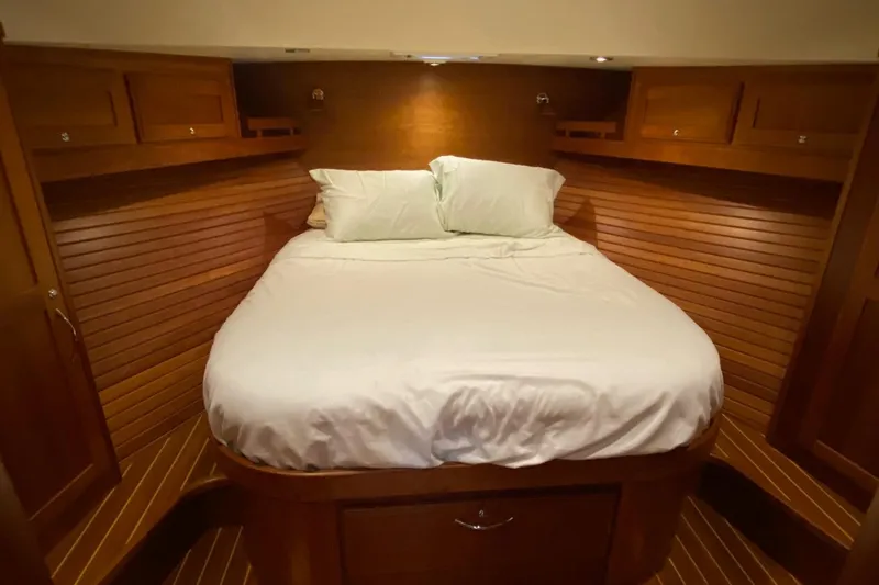 Slide: The Image of Cozy bedroom in 2012 Sabre 48 Salon Express yacht with wooden interior. - 32
