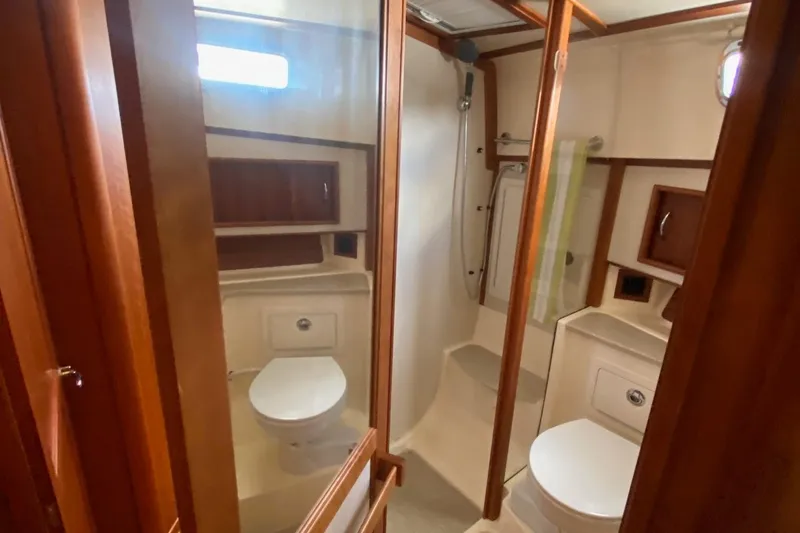 Slide: The Image of Luxurious bathroom in 2012 Sabre 48 Salon Express yacht with wood accents. - 36