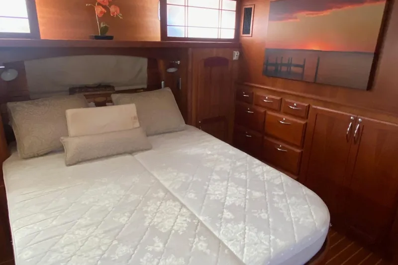Slide: The Image of Luxurious bedroom interior of 2012 Sabre 48 Salon Express yacht with elegant wood finish. - 39