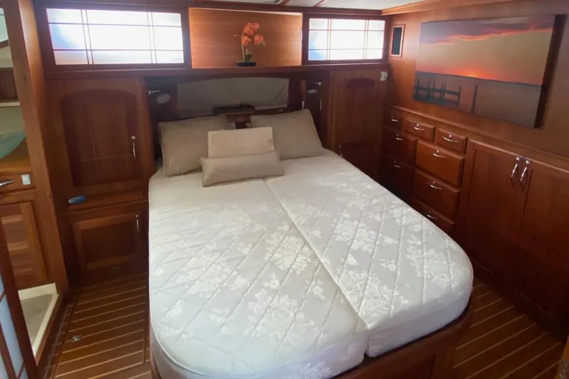 Slide: The Image of Luxurious bedroom interior of 2012 Sabre 48 Salon Express yacht with elegant wood finish. - 40
