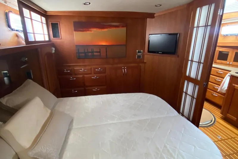 Slide: The Image of Luxurious cabin interior of 2012 Sabre 48 Salon Express yacht with bed and TV. - 41