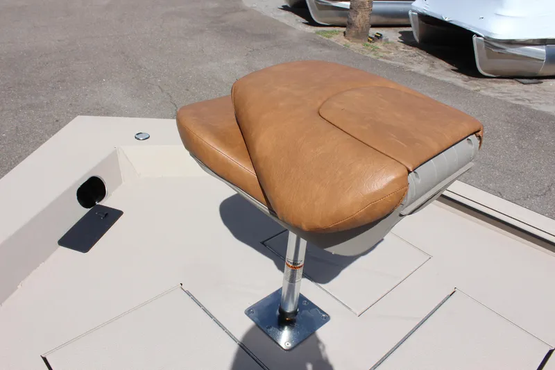 Slide: The Image of Avid 18 Rogue 2024 boat with tan leather seat on deck. - 11