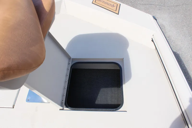Slide: The Image of 2024 Avid 18 Rogue boat storage compartment under seat. - 13