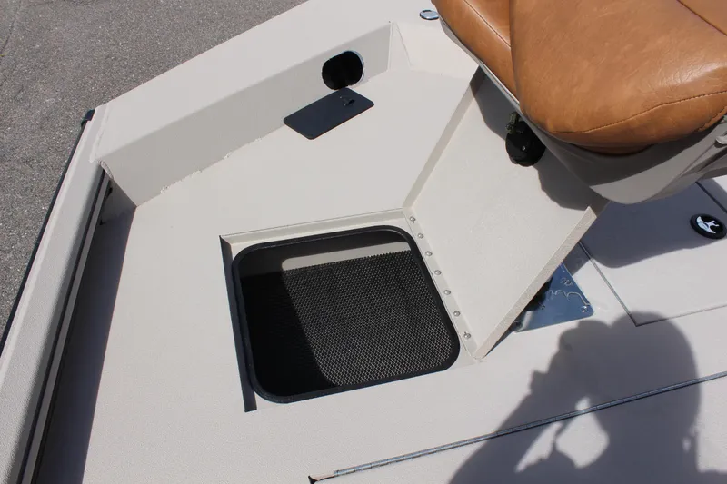 Slide: The Image of 2024 Avid 18 Rogue boat with storage compartment and tan seat. - 14