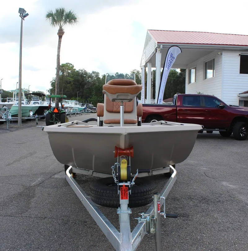 Slide: The Image of 2024 Avid 18 Rogue boat on trailer at dealership. - 2